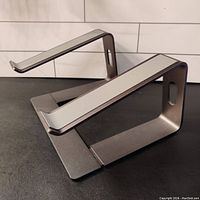 Heavy-duty, all aluminum laptop stand showing its stable and sturdy design with anti-slip pads on top surfaces.