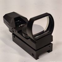 Front angled view showing sight window and mount base