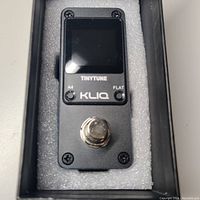 Front view of KLIQ TinyTune tuner pedal showing display, footswitch, and buttons.