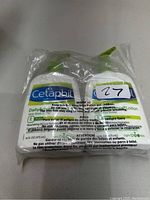 Two bottles of Cetaphil DailyAdvance Ultra Hydrating Lotion in sealed plastic wrap, showing front label with product name and details.
