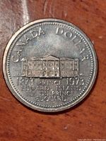 Front view of the coin showing the Prince Edward Island Provincial Legislature and inscriptions.