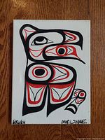 Front view of the painting showing the full Raven design with artist signature and title.