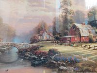 Close-up of the artwork showing the detailed landscape with bridge, cottage and barn, highlighting the painting style and colors.