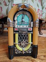 Front view of vintage "Slow Dance" jukebox analog clock showing the clock face and decorative jukebox design.