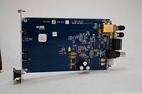 Photo of the blue printed circuit board of the VR1500-R3 video receiver data transmitter card showing connectors and components.