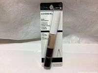 View of the full packaged concealer pen showing transparent tube with concealer, white cap, and blister packaging with product name and vitamin ingredients