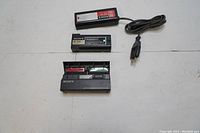 Full lot showing Sony NP-22 battery pack, charger ACP-85UB with power cord, and BCA-85 adapter