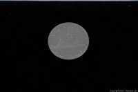 Reverse side of the 1972 Canadian silver dollar showing the voyageur canoe design and the date 1972.