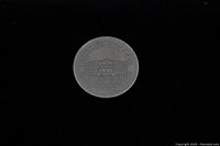 Reverse side of the coin showing the Voyageur design with a canoe and paddlers, with inscriptions including "CANADA DOLLAR" and "1973".