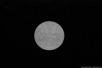 Obverse side of the coin showing the Bluenose schooner with 'CANADA' and 'DOLLAR 1976' inscriptions.