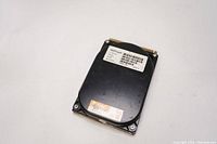 Photo of Conner CP30109 120MB internal hard drive showing black metal casing, labels, and edge connector interface.