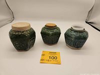 Three vintage ginger jars shown side by side with different lids: clay, cork, and plastic.
