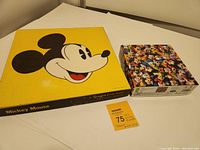 Photo of two boxed Disney Mickey Mouse jigsaw puzzles, vintage yellow Springbok and colorful Ceaco Mickey & Friends.