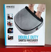 Front view of the HoMedics Double Duty Shiatsu Massager box showing product image and branding.