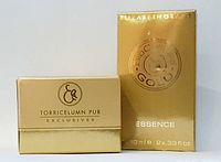Two Elizabeth Grant skincare products in gold packaging photographed side by side.