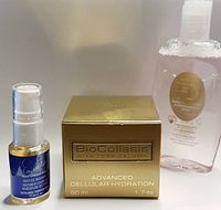 Three skincare products: small blue bottle with white pump, gold box of hydration cream, and clear bottle of pink liquid eye makeup remover