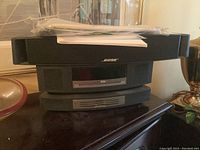 Stacked Bose Wave Music System main unit on top and four-disc changer below