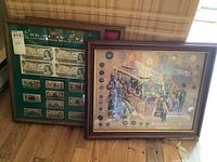 Both framed prints displayed side by side against wall