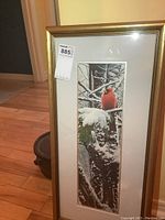 Framed print showing full view of artwork, white matte and gold frame, with auction tag on glass.