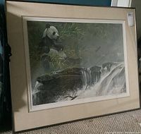 Full front view of framed print leaning against floor