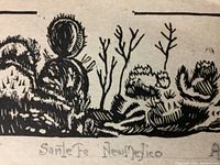 Close-up of the lower middle portion of the print showing the handwritten title 'Santa Fe New Mexico' in pencil below the woodcut artwork.