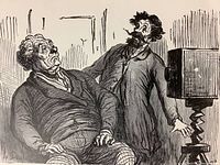 Close-up of the black and white copper engraving print proof depicting two men and a vintage camera