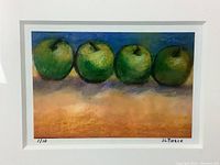 Close-up of the limited edition print showing four green apples with the signature JL Pierce and numbered 1/10.
