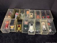 Full view of 16 Matchbox Models of Yesteryear die-cast cars in original clear plastic display cases arranged in two rows.