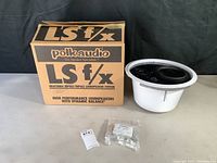 Polk Audio LS F/X loudspeaker with original box and audio connectors on flat surface