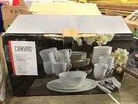 Box view showing the Canvas brand and dinnerware set packaging with product image of dishes, bowls, and mugs.