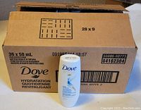 Box carton labeled with Dove branding and counts (36 x 50ml). One Dove bottle placed in front with visible label showing Dove Daily Moisture Conditioner.
