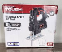 Box front showing Hyper Tough branding, product image of variable speed jig saw, 3.5 amp specification, and features like tool-free blade change and included blades.