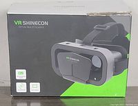 Box packaging of the VR Shinecon virtual reality glasses showing branding and features.