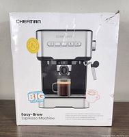 Box front showing Chefman Easy-Brew Espresso Machine image, brand, and product features like one-touch operation and BPA free.