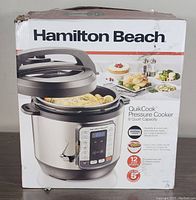 Box of Hamilton Beach QuikCook Pressure Cooker showing brand, model, capacity and key features.