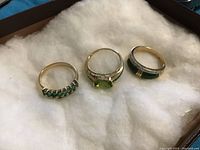 All three rings on white padding