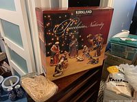 Box of Kirkland Signature porcelain nativity set showing front label and branding.
