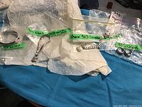 All items laid out with labels indicating markings