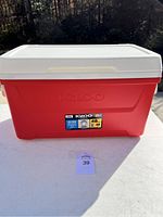 Front view of the red Igloo cooler with a white lid and capacity label showing 48 quarts.