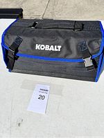 Closed Kobalt branded black and blue tool bag shown from front with Kobalt logo.