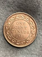 Reverse side showing the denomination and date framed by maple leaves.