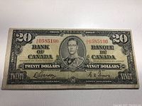 Front view of the 1937 Canadian $20 banknote showing King George VI portrait and serial numbers.