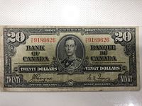 Front face of the 1939 Canadian $20 banknote showing King George VI portrait and serial number H/1 9189626.