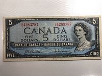 Front side of 1954 Canadian $5 banknote, clearly showing portrait, serial number, and text.