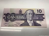 Front view of the 1989 Canadian $10 banknote showing Sir John A. Macdonald portrait and detailed engraving.