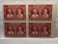 Block of 4 Canada 3 cent brownish-red stamps with portraits of King George V and Queen Mary, perforated, in mint condition with margins visible.