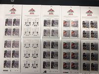 Top view of all five 2012 Grey Cup stamp sheets side by side showing full stamp designs and header logos
