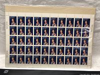 Full sheet pane unopened and sealed in plastic showing 50 stamps with portrait of Queen Elizabeth II.