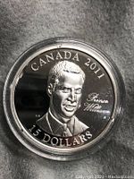 Front side of the Canadian 2011 $15 silver coin showing Prince William's portrait with inscriptions.