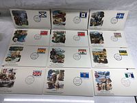 Lot of 12 commemorative envelopes displayed, each decorated with artwork, flags, and postmark from Ottawa, Canada dated 15.VI.79